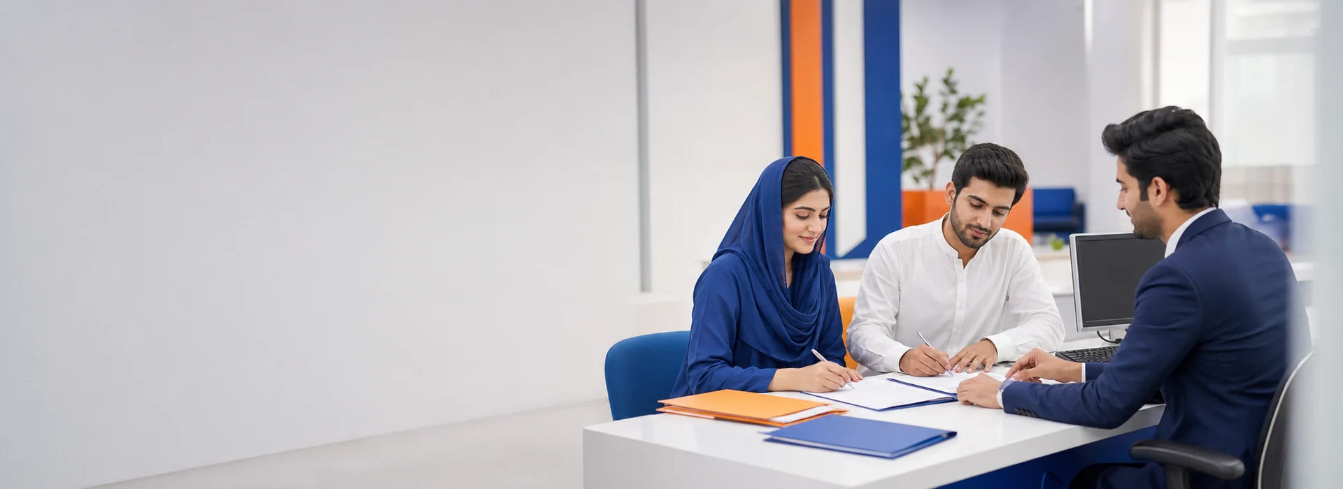 Students completing admission forms with a counselor at a modern college reception