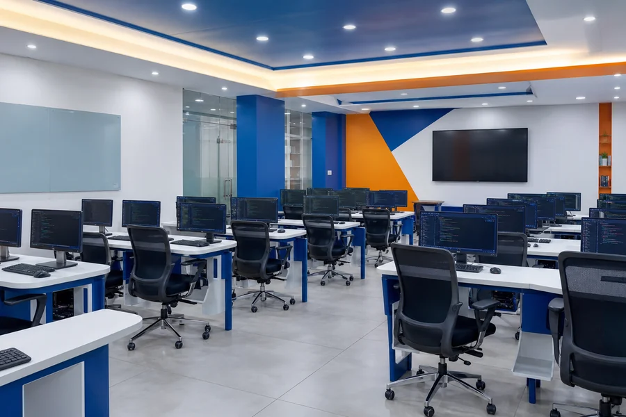 Modern desktop computer lab with coding workstations